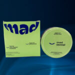 Close-up of Mad Dental whitening powder on toothbrush