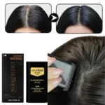 Close-up of brush wand applying black hair color stick
