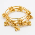 Brass gold Kashmiri ghunghroo bangles set close-up