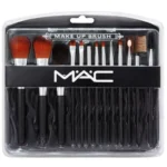 Makeup brushes from Mac Beauty set displayed on white surface