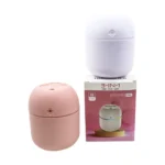 Compact humidifier emitting mist with colorful LED glow