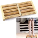 Wooden foot roller massager on white background