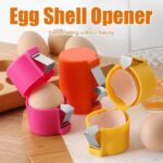 Close-up of egg cracker tool pressing down on egg