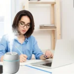 Mini USB air humidifier with colorful LED lighting on desk