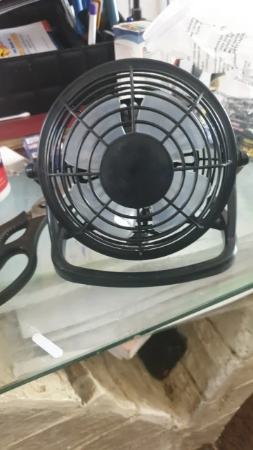 Silent USB Desk Fan 4 Blade Rotatable Mini Cooler photo review