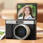 Side angle of mini digital camera with autofocus and flip screen