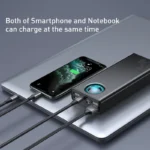 Baseus 30000mAh power bank charging a smartphone and laptop