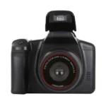 Compact black mirrorless digital camera showing lens and screen