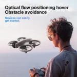 Compact V66 Mini Drone with bright colorful lights in dark