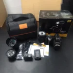 Black DSLR camera showing wide-angle lens attached